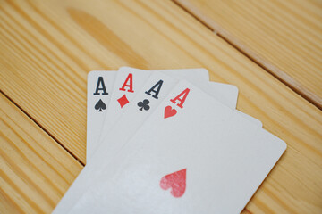 A winning combination of playing cards on a wooden background. card gambling.