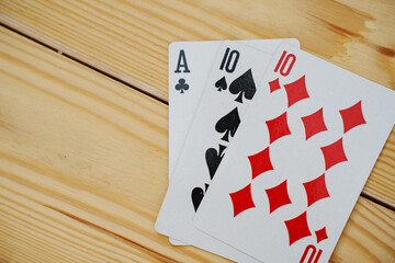 A winning combination of playing cards on a wooden background. card gambling.
