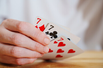A winning combination of playing cards on a wooden background. card gambling.