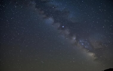 A photo of the night sky with stars and the Milky Way galaxy visible