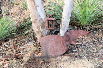 Home made metal gnome sculpture in Australian native bush garden