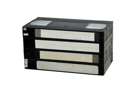 Stack of vintage VHS tapes, retro media storage for movies and home videos.