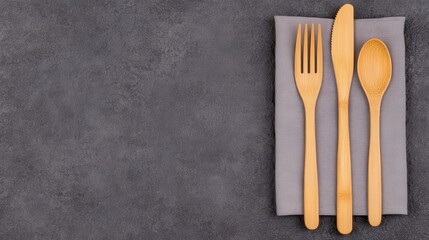 Eco-Friendly Dining Solutions with Reusable Metal Straws, Bamboo Cutlery, and Cloth Napkins on Stylish Gray Background