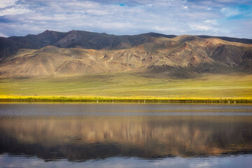 The mountains are reflected in the lake. Nature of Eastern Siberia. Ubsunur basin. Republic of Tuva. Russia