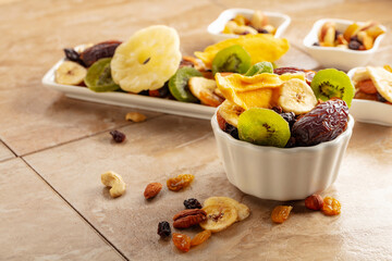 Dried tropical fruits with various nuts and raisins.