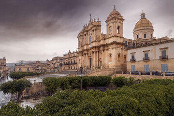 Panoramic cityscape with Cattedrale di San Nicolo ancient catholic cathedral cloudy day, Noto, Italy