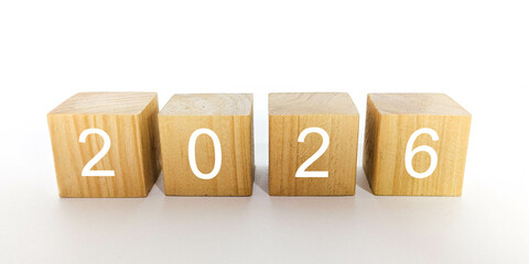 A close up 2026 natural wooden cubes on white background. Minimalist and clean photo for New Year...