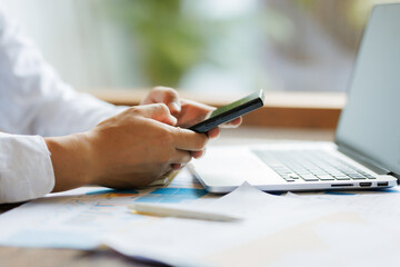 Amidst the scattered paperwork, the determination and diligence of an employee shine through, striving for flawless accuracy in the company&rsquo;s annual review report.