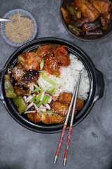 Korean vegan bowl with rice, tofu, eggplant and pepper, kimchi.