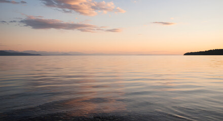 Obraz premium Tranquil Waters Reflecting Dawn: A Peaceful Lake Landscape at Sunrise