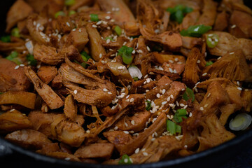 Fried jackfruit as pulled meat vegan in cast iron pan