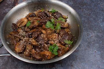 Vegan Korean eggplant gaji namul  in stainless steel pan on gray background, copy space