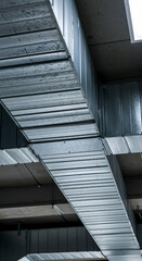 Obraz premium Industrial Ventilation System Metal Ductwork Air Conditioning HVAC Cooling Heating Climate Control Architecture Building Modern Design