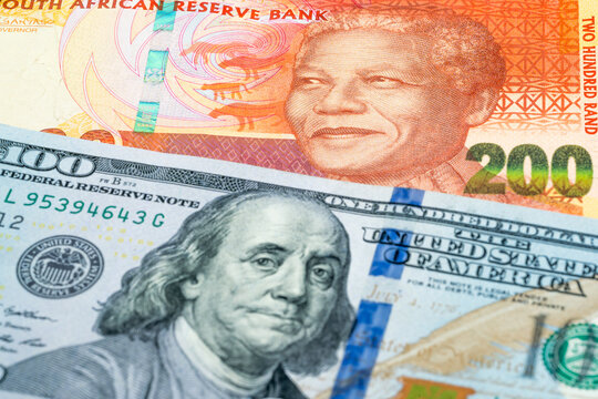 200 South Africa rand and 100 USD dollar banknotes. International trade concept