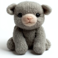 Adorable knitted teddy bear sitting upright, showcasing soft textures and charm