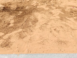 Soil or Mud! Brown ground surface, Close up natural background. Soil wall texture of clay house structure. Fine beach sand, Soil wall of clay house structure, mud background. Vintage tone.