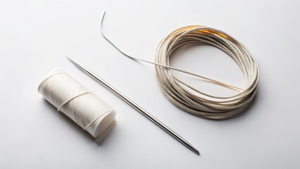 Off-white Yarn, Needle, and Spool on White Background