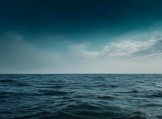 Obraz premium The ocean stretches endlessly, empty and silent, a visual of profound loneliness.