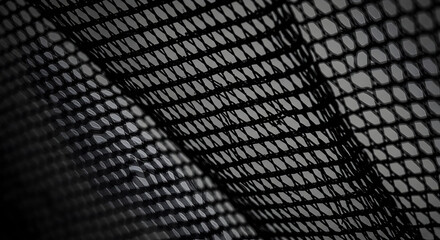 Intricate Black Mesh Textile Creates Modern Abstract Background Pattern