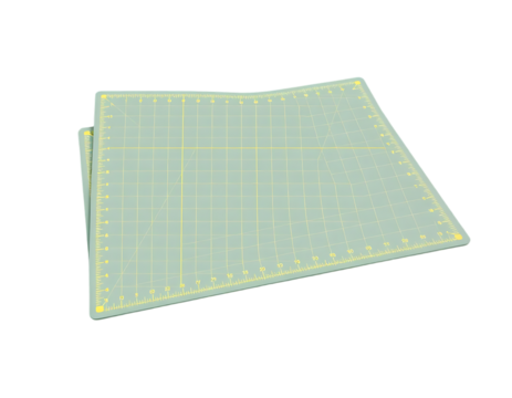 A light blue cutting mat with a yellow grid