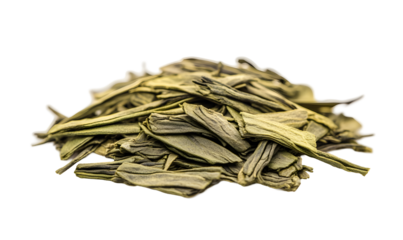 Piled, dried green tea leaves in a textured and abstract presentation on black