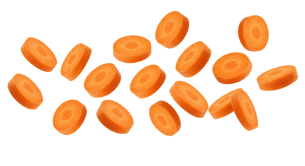 Sliced carrots float in a dark void orange discs suspended in an endless night
