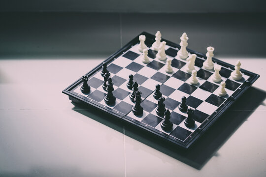 office black white chess board desk. strategic game for brain training in managing business partnership or leadership and win opponent. chess board for professional concept in business development