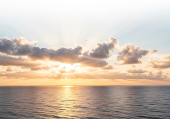 Naklejka premium 穏やか朝焼け海景色 水平線輝く金色の光