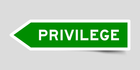 Green color arrow shape sticker label with word privilege on gray background