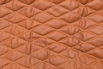 Leather covering with diamond-shaped rivet tape, textile luxury sofa upholstery, car seats background