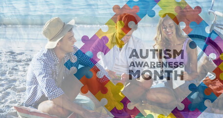 Image of colourful puzzle pieces and autism text over happy friends at summer beach party