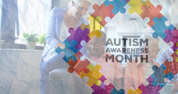 Image of colourful puzzle pieces and autism text over senior friends using electronic devices - Powered by Adobe