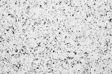 Abstract textured surface with scattered dark specks (1)