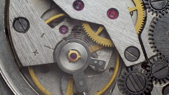 Close-up of clock mechanism of old broken clock