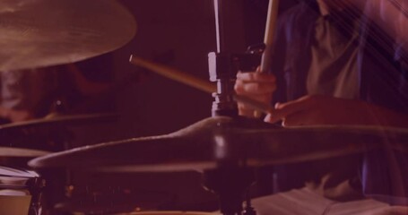 Drum cymbal getting highlighted in animated close-up, showing mounting clamp under warm red lights