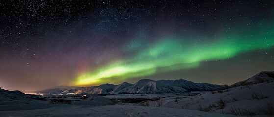 Naklejka premium Aurora borealis night sky stars northern lights winter landscape view