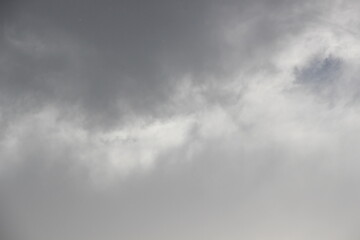 Fototapeta premium moody gray rain clouds texture photo for wallpaper backgrounds, dramatic stormy sky with soft transitions and depth