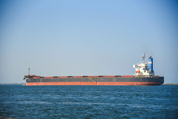 Cargo ship entering the Barra channel in the city of Rio Grande, RS, Brazil...