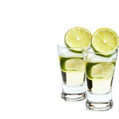Fototapeta premium Zesty Refreshment: Two shot glasses brimming with a clear spirit and adorned with fresh lime wedges, inviting refreshment and zest.