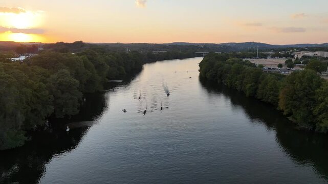 Rowing Boats and Kayaks on River in Austin Texas at Sunset Golden Hour 4K Aerial Drone Video