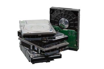 Stack of old hard disk drives and opened HDD case, isolated on transparent background.