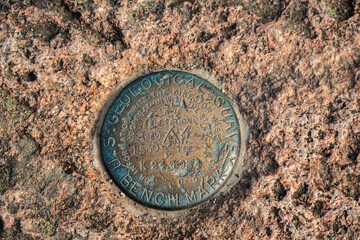 Geological Survey Benchmark Embedded in Rock