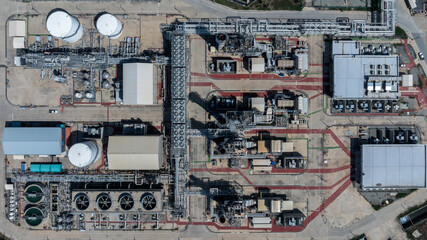 Aerial view energy production facility cogeneration power plant industrial, Industrial energy infrastructure, Power plant oil refinery industrial, Power plant pipeline and cooling system oil refinery.