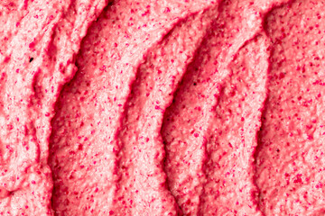 Fruit pink ice cream. Yogurt smoothie with fresh fruits and berries. Ice cream texture. Delicious sweet dessert close-up as background.