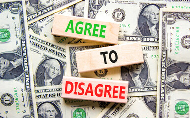 Agree to disagree symbol. Concept words Agree to disagree on beautiful wooden blocks. Dollar bills....