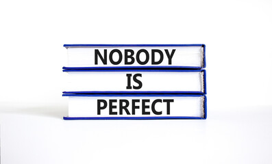 Nobody is perfect symbol. Concept words Nobody is perfect on beautiful books. Beautiful white paper background. Business motivational lifestyle and nobody is perfect concept. Copy space.