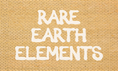 Rare earth elements symbol. Concept words Rare earth elements on beautiful brick wall . Beautiful...