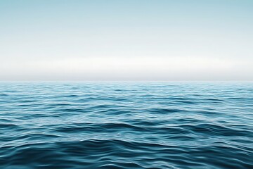 Fototapeta premium A serene ocean view with subtle ripples and gradient shades of turquoise blending into the horizon.
