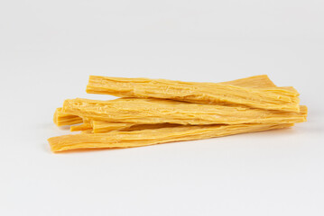 Raw dry Tofu skin or yuba  isolated on white background
