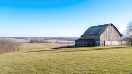 Obraz premium Old wooden barn on a hill